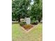 Ansley Park community sign surrounded by lush greenery and colorful flowers at 175 15Th Ne St # 410, Atlanta, GA 30309
