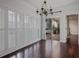 Bright dining room with hardwood floors, plantation shutters, and access to an outdoor patio at 175 15Th Ne St # 410, Atlanta, GA 30309
