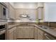 Compact kitchen featuring ample cabinet space, stainless steel appliances, and sleek countertops at 175 15Th Ne St # 410, Atlanta, GA 30309