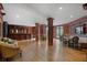 Spacious living room featuring wood paneling, hardwood floors, built in bar, and an inviting seating area at 175 15Th Ne St # 410, Atlanta, GA 30309