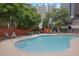 Outdoor pool area with lounge chairs and lush landscaping at 175 15Th Ne St # 410, Atlanta, GA 30309