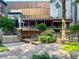 Outdoor retail area with seating, greenery, and attractive storefronts at 175 15Th Ne St # 410, Atlanta, GA 30309