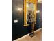Hallway features a decorative gold mirror with antique clock and stylish sconce lighting at 3180 Mathieson Drive # 502, Atlanta, GA 30305