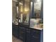 Kitchen featuring dark cabinetry, glass displays, and sleek countertops at 3180 Mathieson Drive # 502, Atlanta, GA 30305
