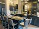 This kitchen features an island with granite countertop and modern stainless steel appliances at 3180 Mathieson Drive # 502, Atlanta, GA 30305