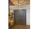 Spacious living area featuring a sliding barn door and a display cabinet at 3180 Mathieson Drive # 502, Atlanta, GA 30305