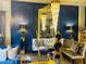 Living room featuring ornate mirror, designer seating, and stylish lighting at 3180 Mathieson Drive # 502, Atlanta, GA 30305