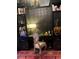 A study with shelves, a desk with lamp, designer chair, and ornate decor at 3180 Mathieson Drive # 502, Atlanta, GA 30305