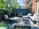 Serene outdoor patio with comfortable seating, water feature, and lush greenery perfect for relaxing at 3180 Mathieson Drive # 502, Atlanta, GA 30305