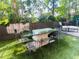 Inviting outdoor dining area with glass table, seating, and beautiful greenery for al fresco meals at 3180 Mathieson Drive # 502, Atlanta, GA 30305