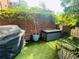 Cozy outdoor area features a grill, storage, and dining space, set against a brick and greenery backdrop at 3180 Mathieson Drive # 502, Atlanta, GA 30305