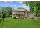 Spacious backyard featuring a lush lawn and mature trees at 6165 Pin Oak Ln, Alpharetta, GA 30005