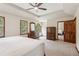 This expansive bedroom showcases tray ceilings, neutral walls, and ample natural light at 6165 Pin Oak Ln, Alpharetta, GA 30005