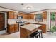 Spacious kitchen with granite counters, island, stainless appliances, and ample cabinet space at 6165 Pin Oak Ln, Alpharetta, GA 30005