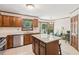 Bright kitchen features granite counters, stainless steel appliances, and an island at 6165 Pin Oak Ln, Alpharetta, GA 30005