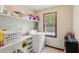 Functional laundry room featuring a washer and dryer at 6165 Pin Oak Ln, Alpharetta, GA 30005