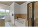 Bathroom featuring a jacuzzi tub and a stand-up shower at 1786 Dekalb Ne Ave, Atlanta, GA 30307