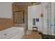 Bathroom with jacuzzi tub and glass shower at 1786 Dekalb Ne Ave, Atlanta, GA 30307