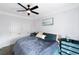 Cozy bedroom with a ceiling fan, comfortable queen-sized bed, and large closet doors for ample storage at 1786 Dekalb Ne Ave, Atlanta, GA 30307