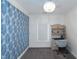 Bedroom featuring blue wallpaper, a window with blinds, and a wooden desk with chair at 1786 Dekalb Ne Ave, Atlanta, GA 30307