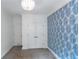 Bedroom featuring blue wallpaper and double doors at 1786 Dekalb Ne Ave, Atlanta, GA 30307