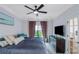 Comfortable bedroom featuring a ceiling fan and large dresser at 1786 Dekalb Ne Ave, Atlanta, GA 30307