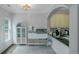 Bright breakfast area with white furnishings, cabinets, and view into the kitchen at 1786 Dekalb Ne Ave, Atlanta, GA 30307