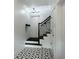 Bright entryway featuring patterned tile floor, stairs, and an umbrella coat rack at 1786 Dekalb Ne Ave, Atlanta, GA 30307