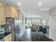Spacious kitchen with stainless steel appliances, light cabinets, and dark hardwood floors at 1786 Dekalb Ne Ave, Atlanta, GA 30307