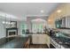 An open kitchen with stainless steel appliances, granite countertops, and dark hardwood floors at 1786 Dekalb Ne Ave, Atlanta, GA 30307