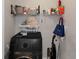 Laundry room with modern washer/dryer unit and open shelving for storage at 1786 Dekalb Ne Ave, Atlanta, GA 30307
