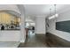 Open living room showcasing hardwood floors, seamless flow into the kitchen, and nearby staircase at 1786 Dekalb Ne Ave, Atlanta, GA 30307
