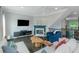 Comfortable living room featuring white sofas, a modern fireplace, and sleek furnishings under modern lighting at 1786 Dekalb Ne Ave, Atlanta, GA 30307