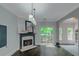 Spacious living area featuring fireplace, access to outdoor deck and seamless flow into dining area at 1786 Dekalb Ne Ave, Atlanta, GA 30307