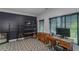 Modern home office with stylish black accent wall, graphic floor, and functional desk setup for a productive workspace at 1786 Dekalb Ne Ave, Atlanta, GA 30307