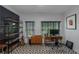 Bright home office with patterned tile floor, featuring a large window, desk, and shelving unit for a functional workspace at 1786 Dekalb Ne Ave, Atlanta, GA 30307