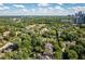 Aerial view of home in neighborhood with wooded surroundings at 21 Barksdale Ne Dr, Atlanta, GA 30309