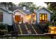 Inviting backyard with well-lit stairs, manicured lawn, and a water fountain at 21 Barksdale Ne Dr, Atlanta, GA 30309