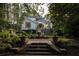 Beautiful backyard with stone stairs, fountain, and lush landscaping at 21 Barksdale Ne Dr, Atlanta, GA 30309
