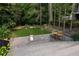 Spacious backyard with lush green lawn, mature trees, and stone patio for outdoor living at 21 Barksdale Ne Dr, Atlanta, GA 30309