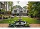 Backyard with water fountain, patio, and staircase at 21 Barksdale Ne Dr, Atlanta, GA 30309