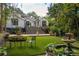 Large grassy backyard with patio, fountain, and staircase at 21 Barksdale Ne Dr, Atlanta, GA 30309