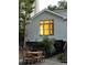 Backyard of home with dining table and view into home through large window at 21 Barksdale Ne Dr, Atlanta, GA 30309