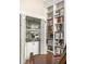 Cozy bar alcove with mirrored backsplash, glassware display, and built-in shelving at 21 Barksdale Ne Dr, Atlanta, GA 30309