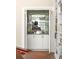 Close-up of bar alcove featuring custom cabinetry and a mirrored backdrop to display glassware at 21 Barksdale Ne Dr, Atlanta, GA 30309