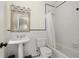 Clean bathroom with a pedestal sink, shower, and checkered tile floor at 21 Barksdale Ne Dr, Atlanta, GA 30309