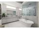 Bright, modern bathroom with standalone tub, glass shower and dual sink vanity at 21 Barksdale Ne Dr, Atlanta, GA 30309