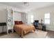 Cozy bedroom with a built-in murphy bed, desk, chair, and bright natural light at 21 Barksdale Ne Dr, Atlanta, GA 30309