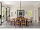 Elegant dining room featuring a wooden table set with chairs, ornate chandelier, and natural light at 21 Barksdale Ne Dr, Atlanta, GA 30309