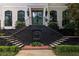 Elegant home entrance featuring dual stairways and a decorative lion fountain at 21 Barksdale Ne Dr, Atlanta, GA 30309